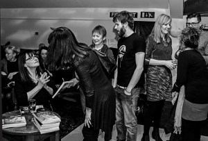 Kerry signs books for fans...